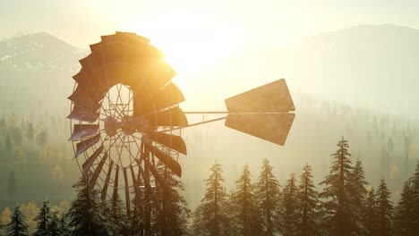 Typical-Old-Windmill-turbine-in-forest-at-sunset